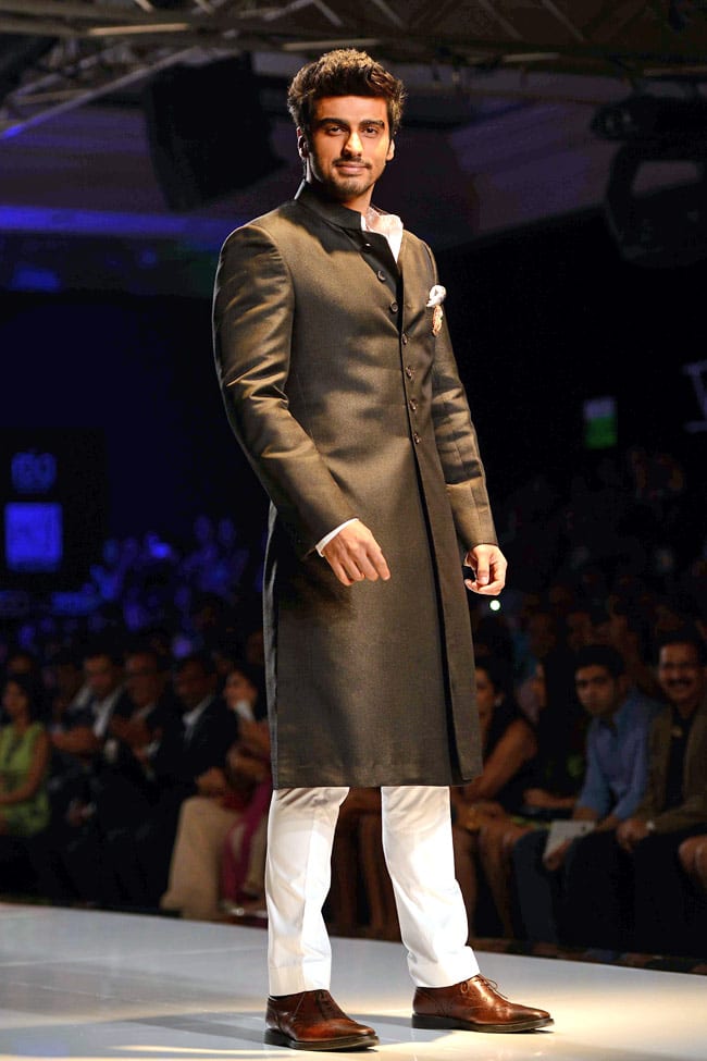 black sherwani with shoes and white pant