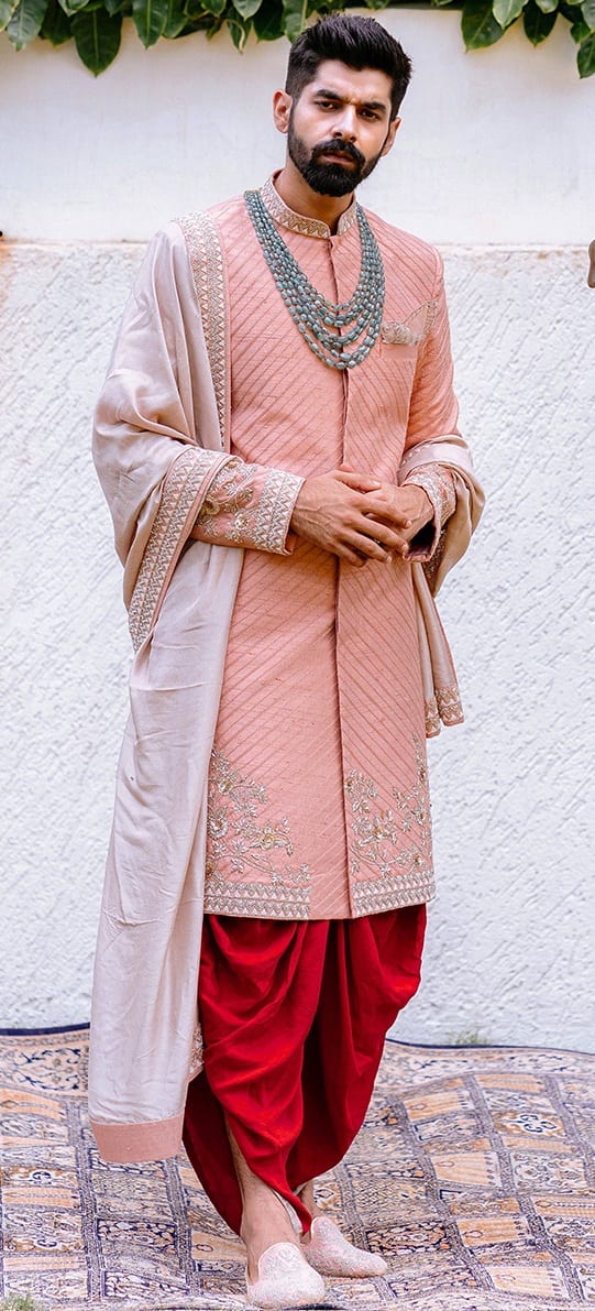 Royal Sherwani with dhoti and an ivory bordered dupatta Royal Sherwani with dhoti and an ivory bordered dupatta