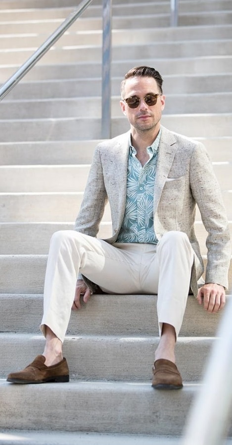 A blue printed shirt paired under a grey coat white pants & brown shoes - Printed Shirt Combinationss for Men A blue printed shirt paired under a grey coat white pants & brown shoes - Printed Shirt Combinationss for Men