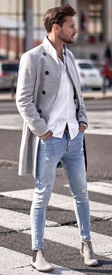 Long over coat with white shirt wearing slightly ripped jeans and grey boots Long over coat with white shirt wearing slightly ripped jeans and grey boots