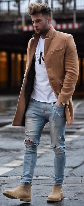 White t-shirt with ripped denims and light brown long overcoat and brown boots_ White t-shirt with ripped denims and light brown long overcoat and brown boots_