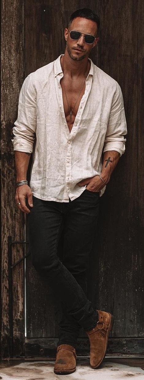 beige shirt with rolled up sleeves paired with black denims accessorized with shades, bracelet and locket_ beige shirt with rolled up sleeves paired with black denims accessorized with shades, bracelet and locket_