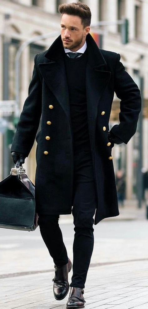 black overcoat with white undershirt and a tie, wearing a shoe and holding a bag in hand black overcoat with white undershirt and a tie, wearing a shoe and holding a bag in hand