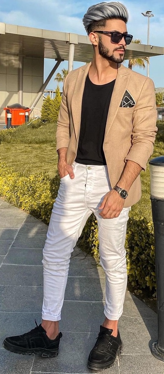black t-shirt with beige suit and white chinos and black boots, accessorized with shades and pocket square_ black t-shirt with beige suit and white chinos and black boots, accessorized with shades and pocket square_