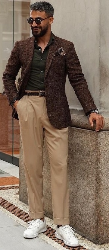 green undershirt with beige trousers and brown leather jacket, wearing shades and white sneakers_ green undershirt with beige trousers and brown leather jacket, wearing shades and white sneakers_