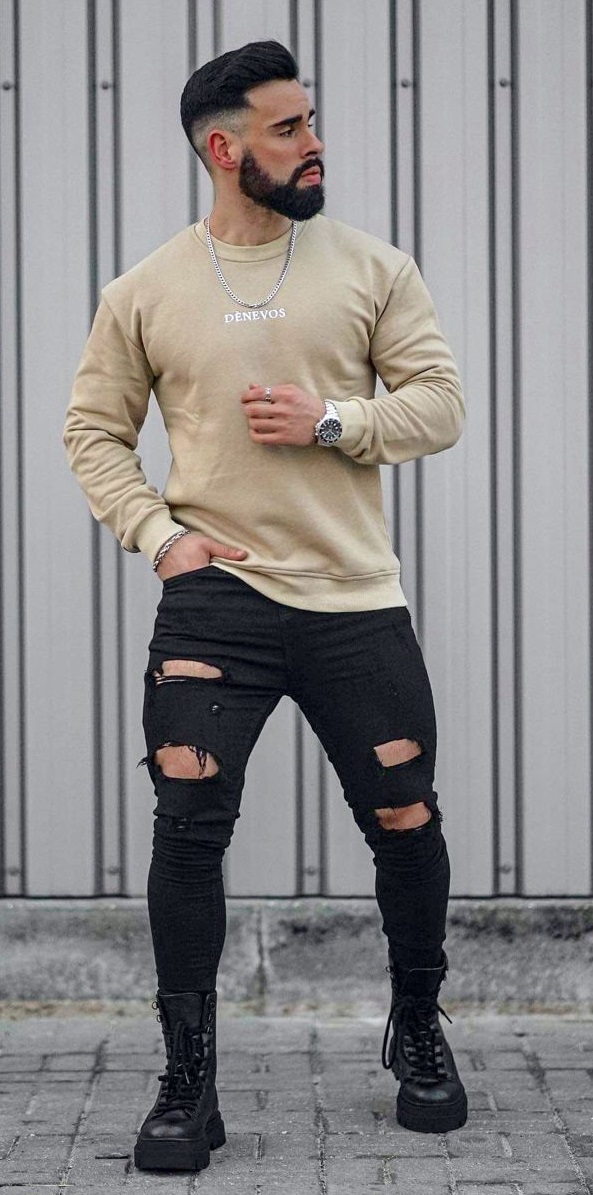 ripped black denims with beige t-shirt accessorized with a watch and laced shoes_ ripped black denims with beige t-shirt accessorized with a watch and laced shoes_