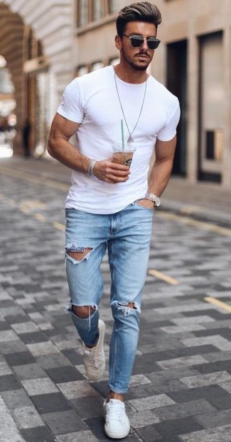 ripped denims with white t-shirt, accessorized with locket, bracelet, shades and a watch wearing white sneakers_ ripped denims with white t-shirt, accessorized with locket, bracelet, shades and a watch wearing white sneakers_