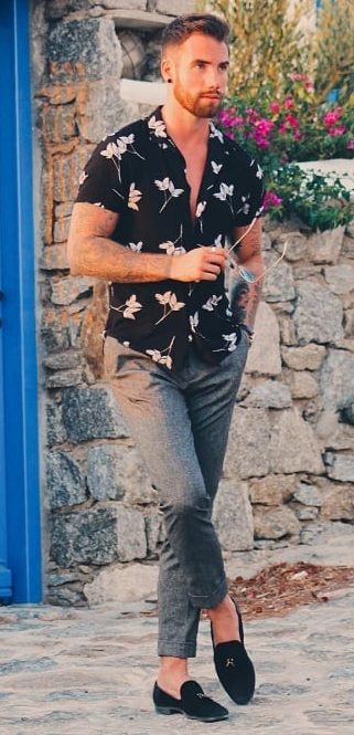Black shirt with white flower paired with grey chinos and suede Black shirt with white flower paired with grey chinos and suede