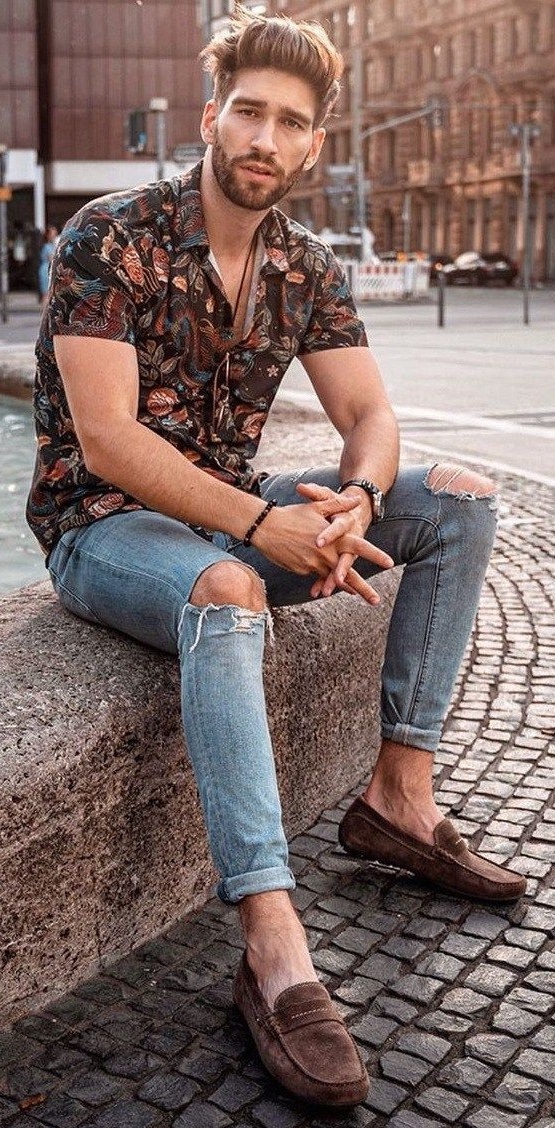 Floral shirt with ripped denims and waist accessories wearing suedes Floral shirt with ripped denims and waist accessories wearing suedes