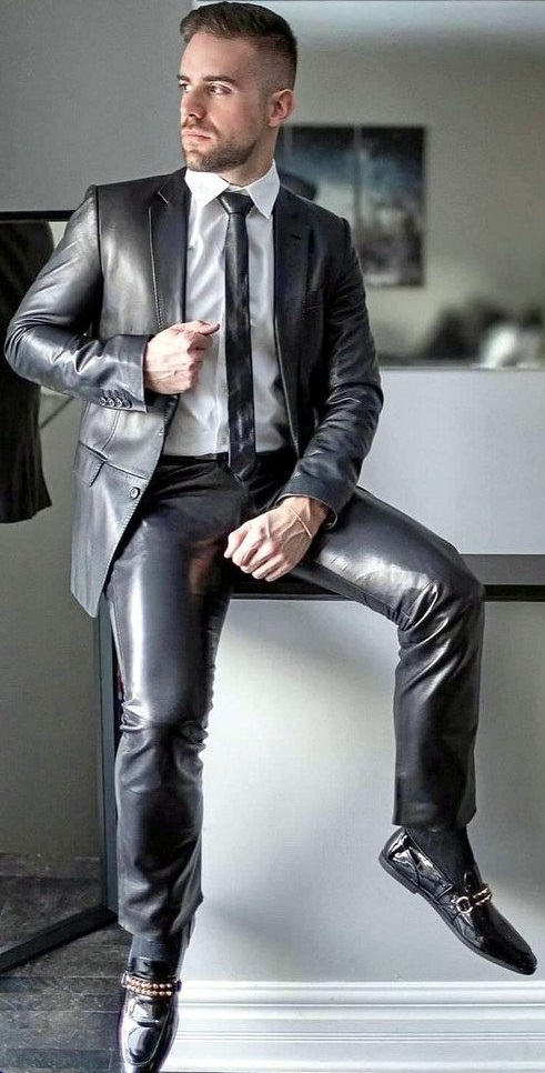 Grey shiny suit with same colored tie and formal shoes Grey shiny suit with same colored tie and formal shoes
