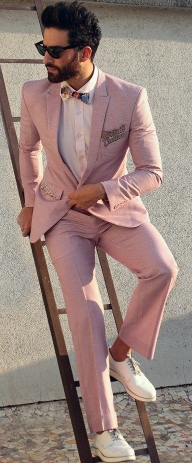 Pink suit with white shirt and bow tie and white sneakers Pink suit with white shirt and bow tie and white sneakers