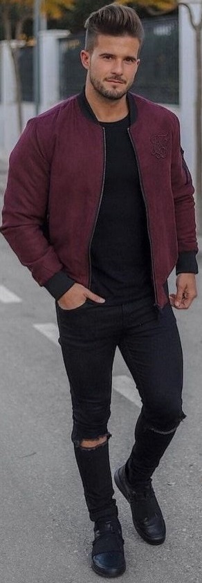 maroon bomber jacket with black shirt and black ripped denims, with black footwear maroon bomber jacket with black shirt and black ripped denims, with black footwear