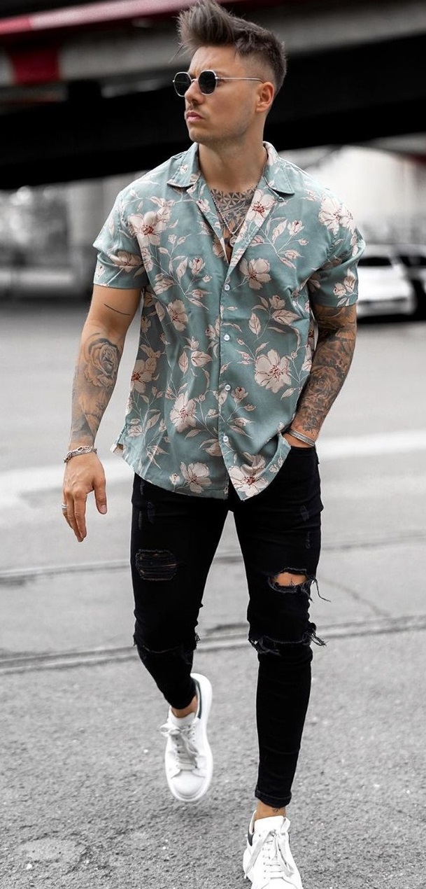 floral green shirt with ripped black denims and white sneakers floral green shirt with ripped black denims and white sneakers