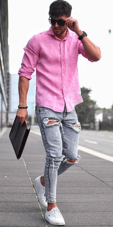 pink shirt with ripped greyish blue denims and white sneakers pink shirt with ripped greyish blue denims and white sneakers