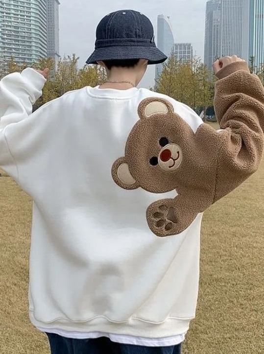 white hoodie with a teddy back print, the print runs from back to sleeve white hoodie with a teddy back print, the print runs from back to sleeve