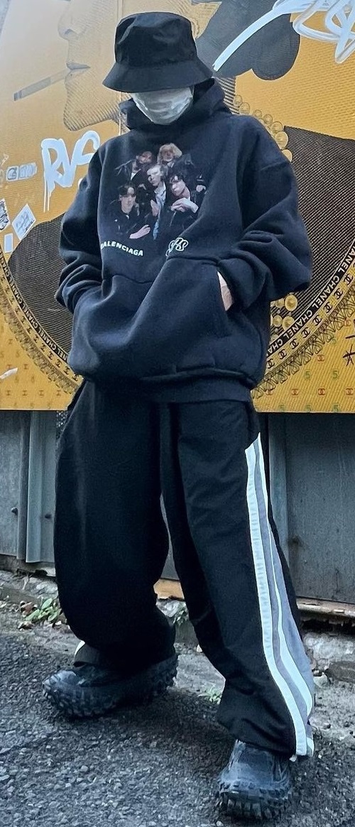 Balenciaga Oversized Hoodies with a baggy bottom accessorized with a cap, mask and completing the look with sneakers being one of the must-have products to own Balenciaga Oversized Hoodies with a baggy bottom accessorized with a cap, mask and completing the look with sneakers being one of the must-have products to own
