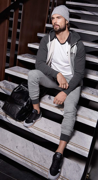 a grey bottom with similar color jacket and a white tshirt with a sneaker brand - Reebok a grey bottom with similar color jacket and a white tshirt with a sneaker brand - Reebok