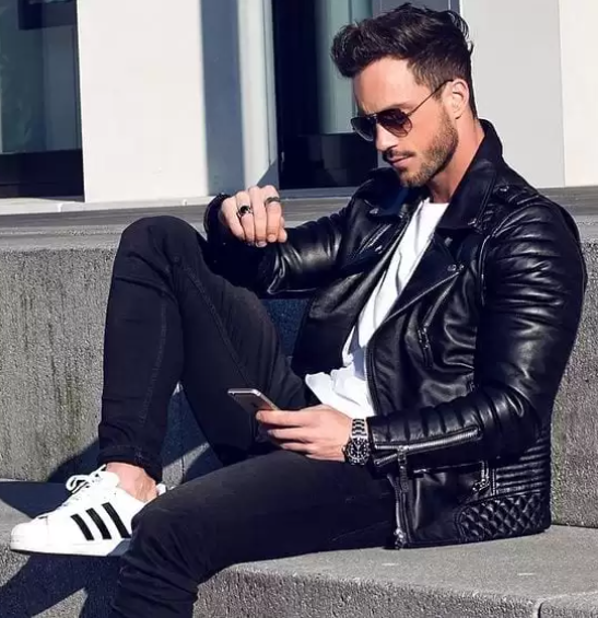a leather jacket with a white tshirt and a black bottom with a sneaker brand adidas a leather jacket with a white tshirt and a black bottom with a sneaker brand adidas