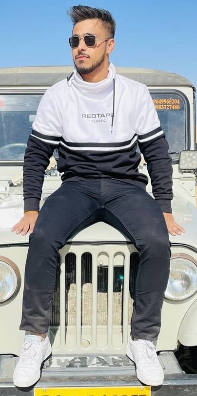 a sweatshirt with a black denim and a shades with a sneaker brand - Reebok a sweatshirt with a black denim and a shades with a sneaker brand - Reebok