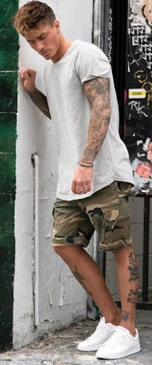 grey tshirt with a printed cargo pant, accessorized with a bracelet and white sneakers grey tshirt with a printed cargo pant, accessorized with a bracelet and white sneakers