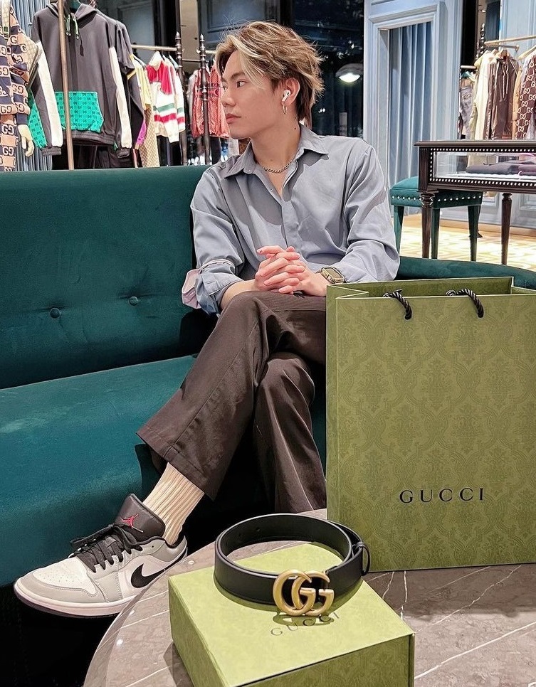shirt with chinos and sneakers with a Gucci belt kept above the box, being a must-have product to own shirt with chinos and sneakers with a Gucci belt kept above the box, being a must-have product to own