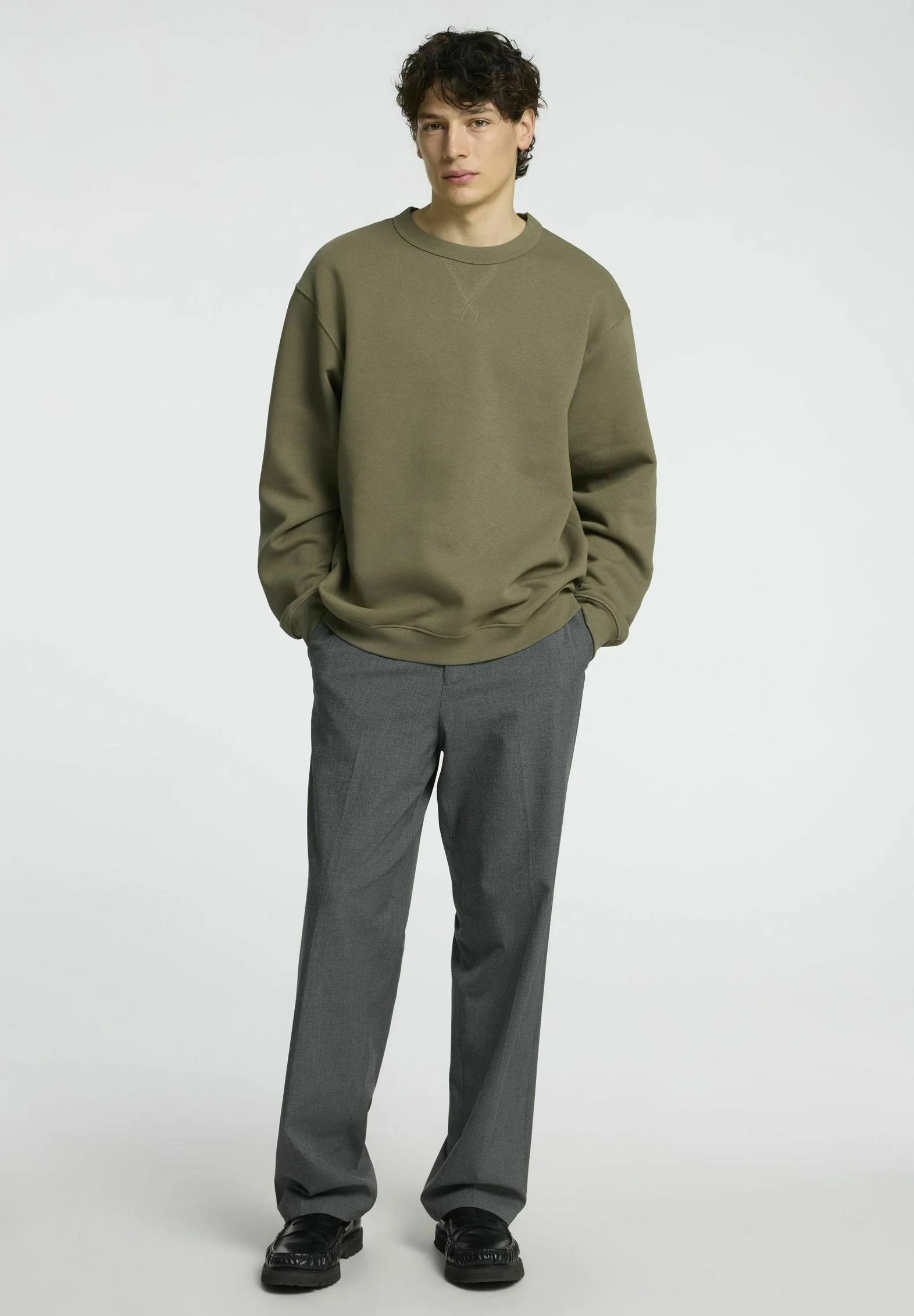 Sweatshirt Paired with Tailored Trousers Sweatshirt Paired with Tailored Trousers